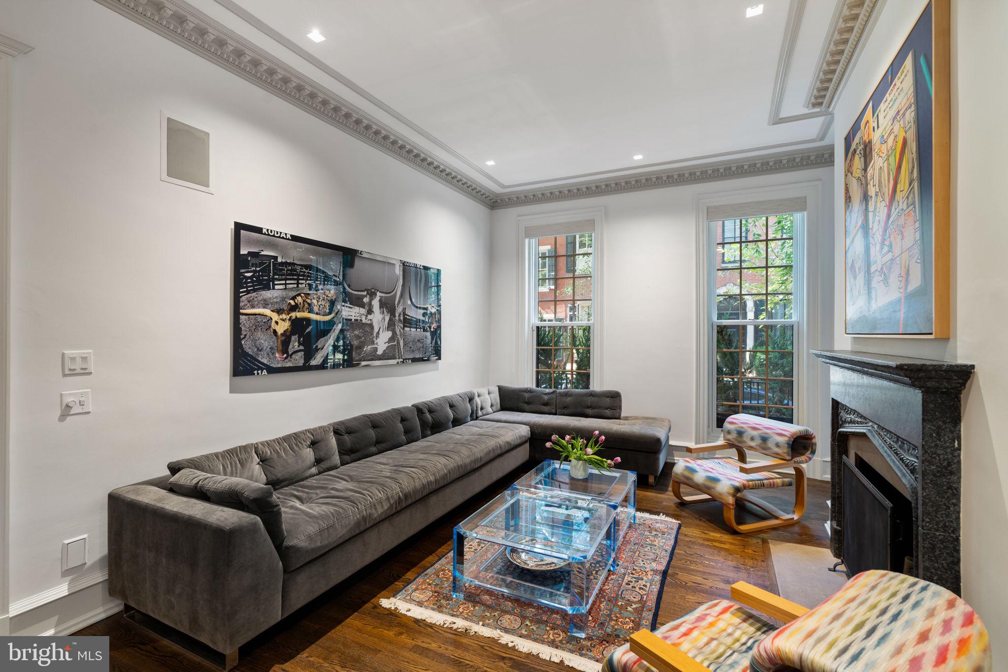 1819 Delancey Place Philadelphia, PA 19103 - Photo 12 of 76 a living room with furniture fireplace and a large window