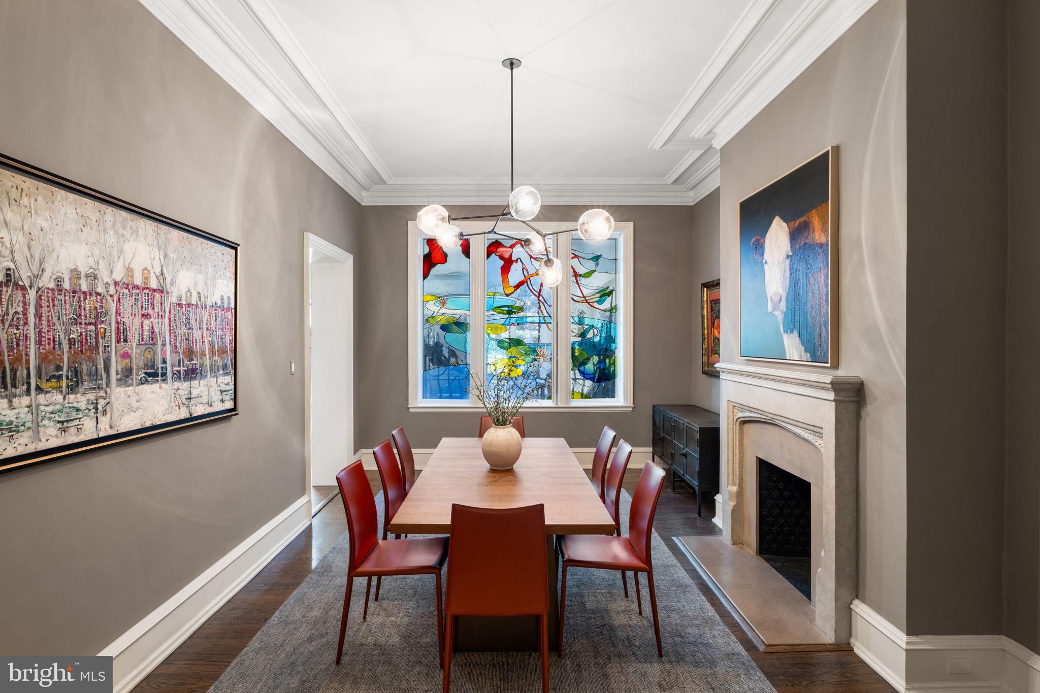 1819 Delancey Place Philadelphia, PA 19103 - Photo 17 of 76 a view of a dining room with furniture a chandelier window and wooden floor