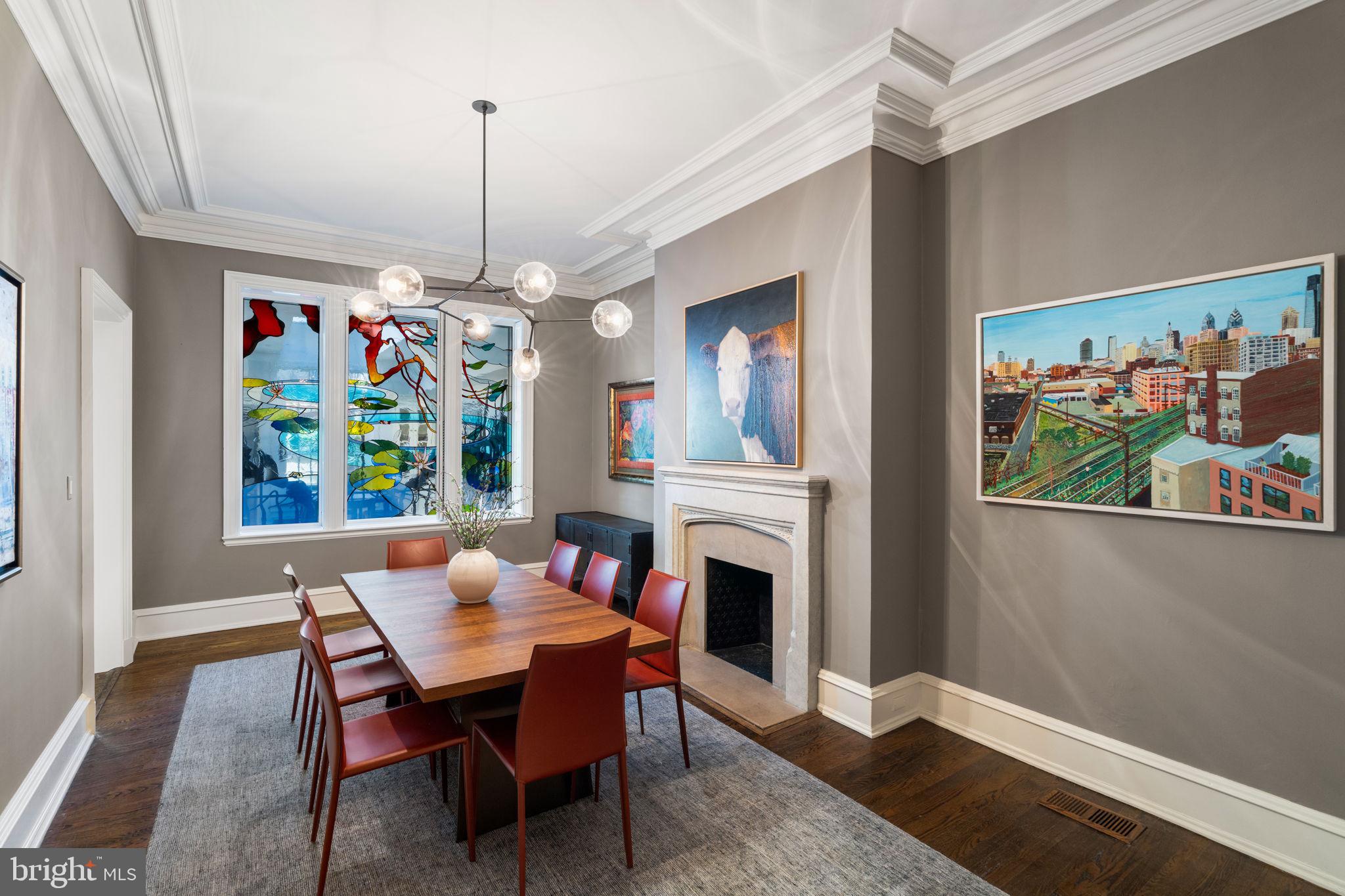 1819 Delancey Place Philadelphia, PA 19103 - Photo 18 of 76 a dining room with furniture a chandelier and wooden floor