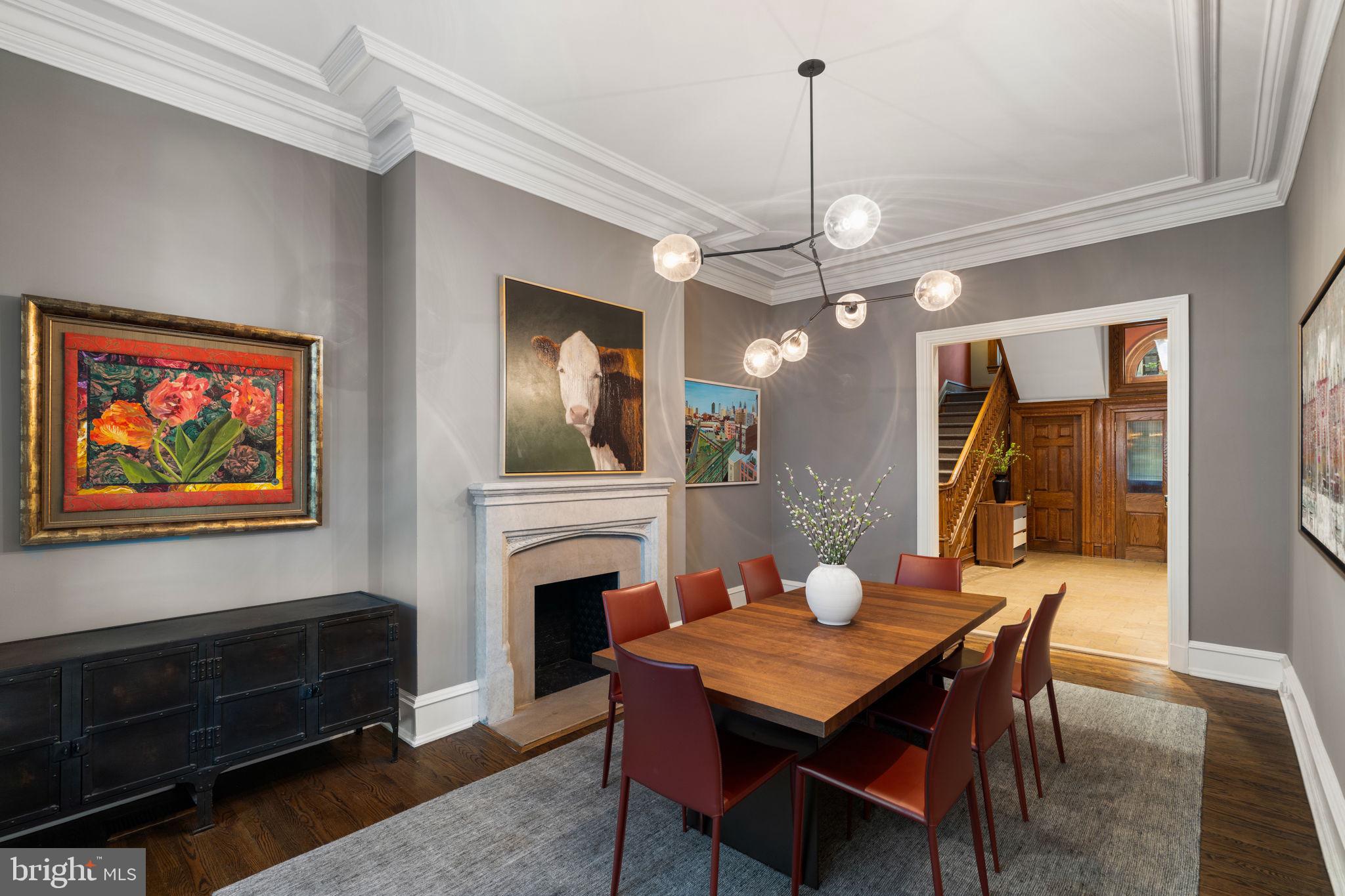 1819 Delancey Place Philadelphia, PA 19103 - Photo 19 of 76 a dining room with furniture a chandelier and wooden floor