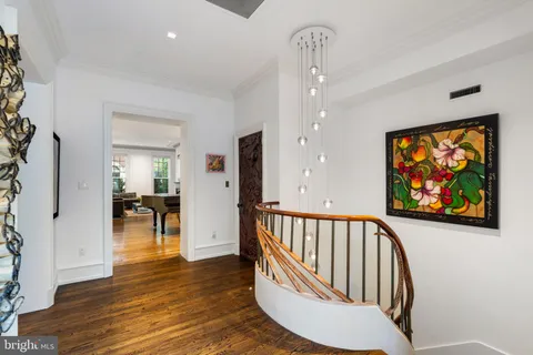 a kitchen with stainless steel appliances kitchen island granite countertop a stove a sink and a microwave