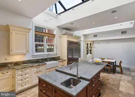 a living room with furniture and a rug