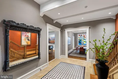 a view of living room with furniture and a fireplace