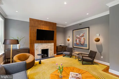 a spacious bedroom with a bed and a fireplace