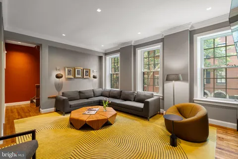 a bedroom with a bed and a fireplace