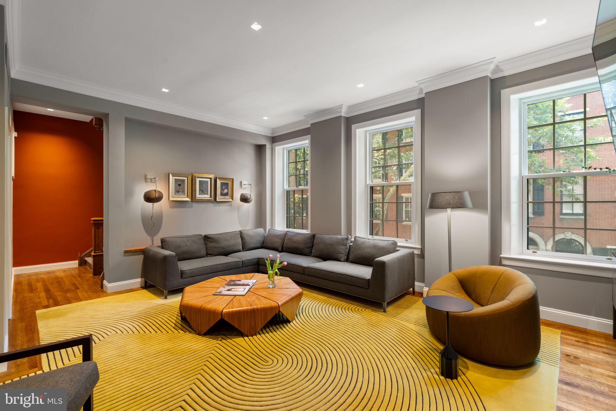1819 Delancey Place Philadelphia, PA 19103 - Photo 38 of 76 a living room with furniture and a large window