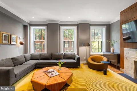 a bedroom with a bed a table and chair