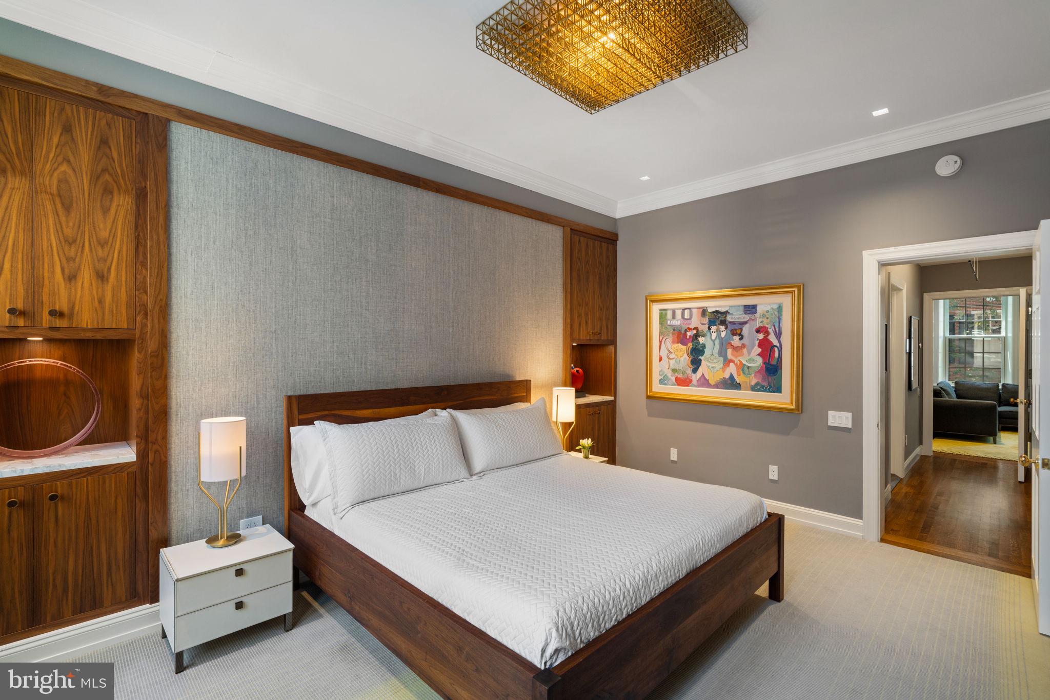 1819 Delancey Place Philadelphia, PA 19103 - Photo 42 of 76 a bedroom with a bed a painting on the wall and a dresser
