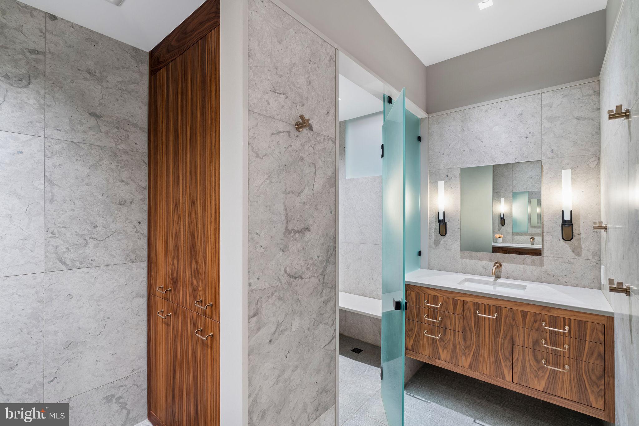 1819 Delancey Place Philadelphia, PA 19103 - Photo 46 of 76 a spacious bathroom with a granite countertop sink mirror and shower