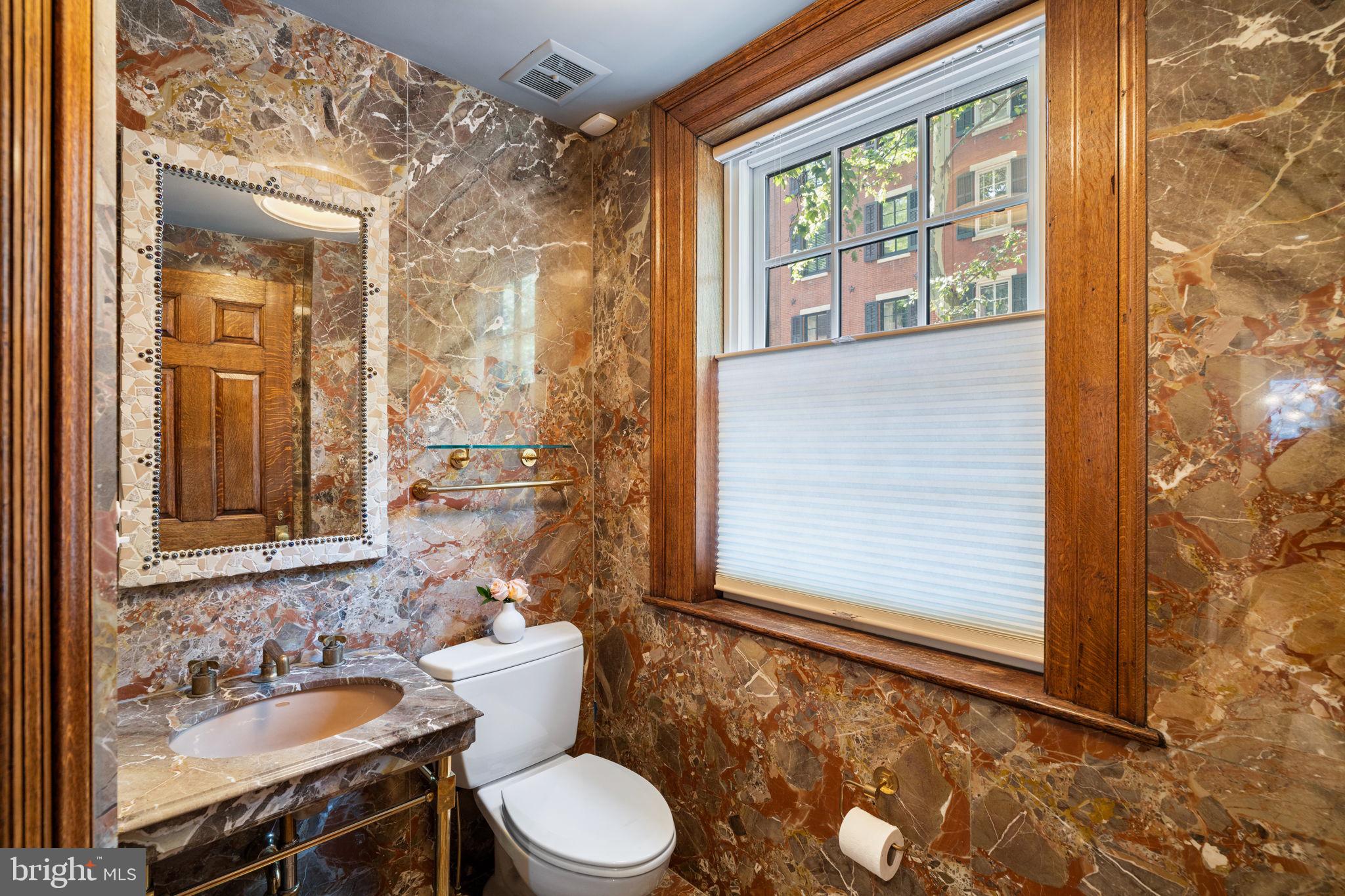 1819 Delancey Place Philadelphia, PA 19103 - Photo 6 of 76 a bathroom with a sink a toilet and shower