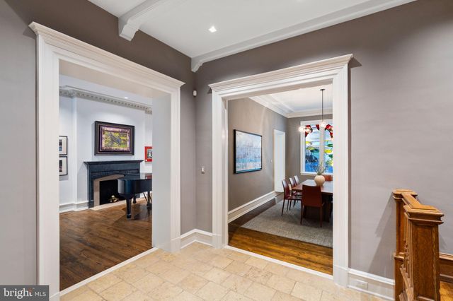 a living room with furniture fireplace and a window