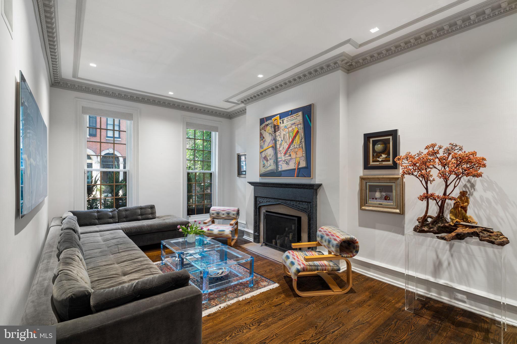 1819 Delancey Place Philadelphia, PA 19103 - Photo 9 of 76 a living room with furniture and a fireplace