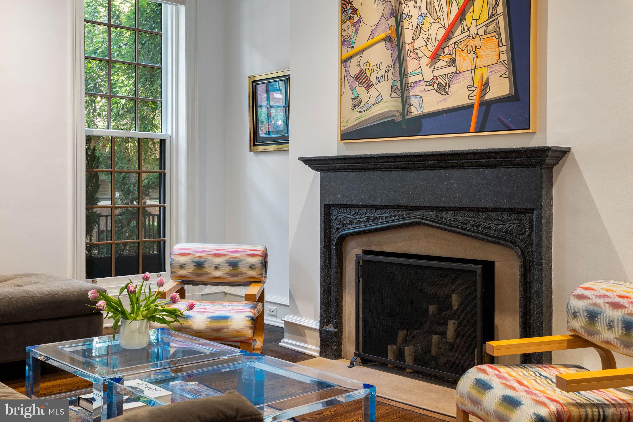 1819 Delancey Place Philadelphia, PA 19103 - Photo 10 of 76 a living room with furniture a window and a fireplace