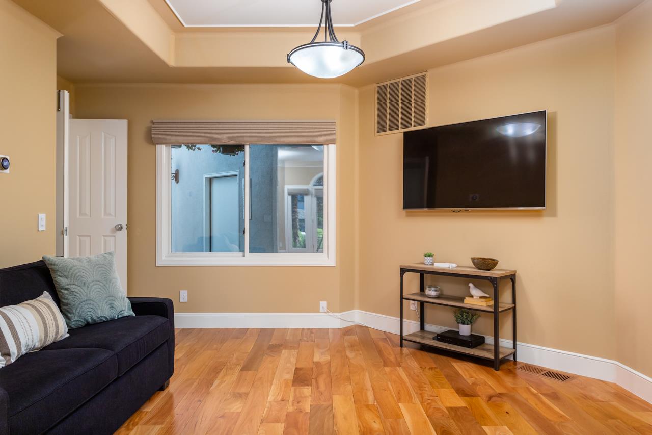 146 Giffin Road Los Altos, CA 94022 - Photo 7 of 34 a living room with a flat screen tv and a lamp