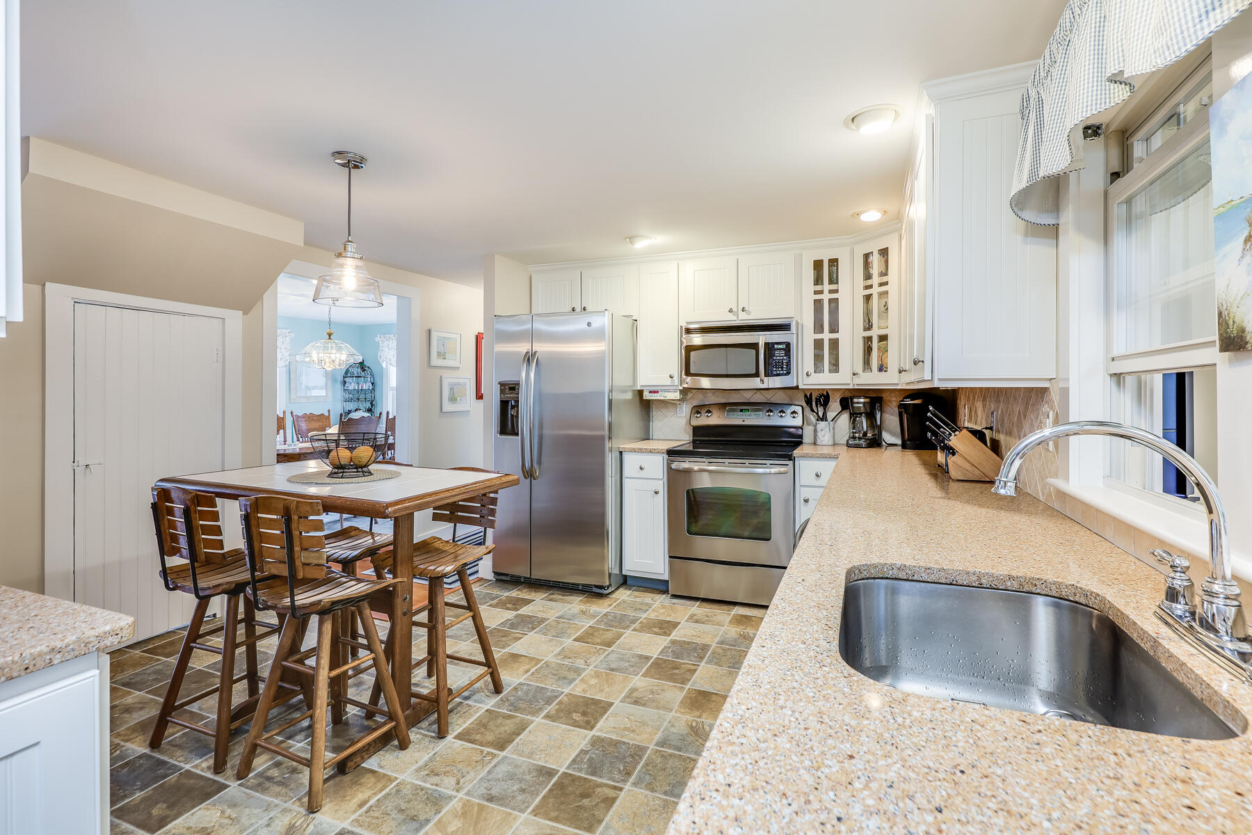 16 Hamilton Road Dennis Port, MA 02639 - Photo 15 of 66 a kitchen with granite countertop a sink appliances and cabinets
