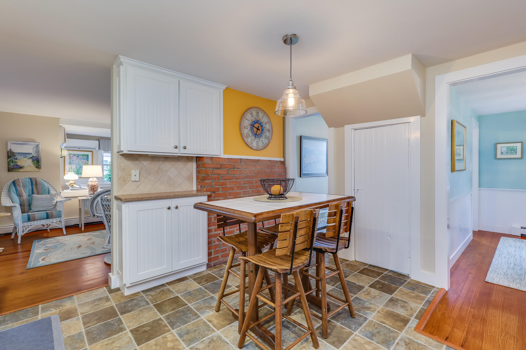 16 Hamilton Road Dennis Port, MA 02639 - Photo 9 of 66 a kitchen with a dining table chairs and white cabinets