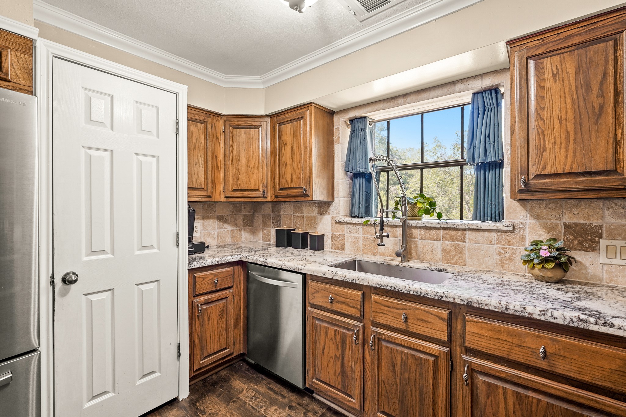 1505 Wagon Road Simonton, TX 77485 - Photo 13 of 50 a kitchen with stainless steel appliances granite countertop a sink stove and cabinets