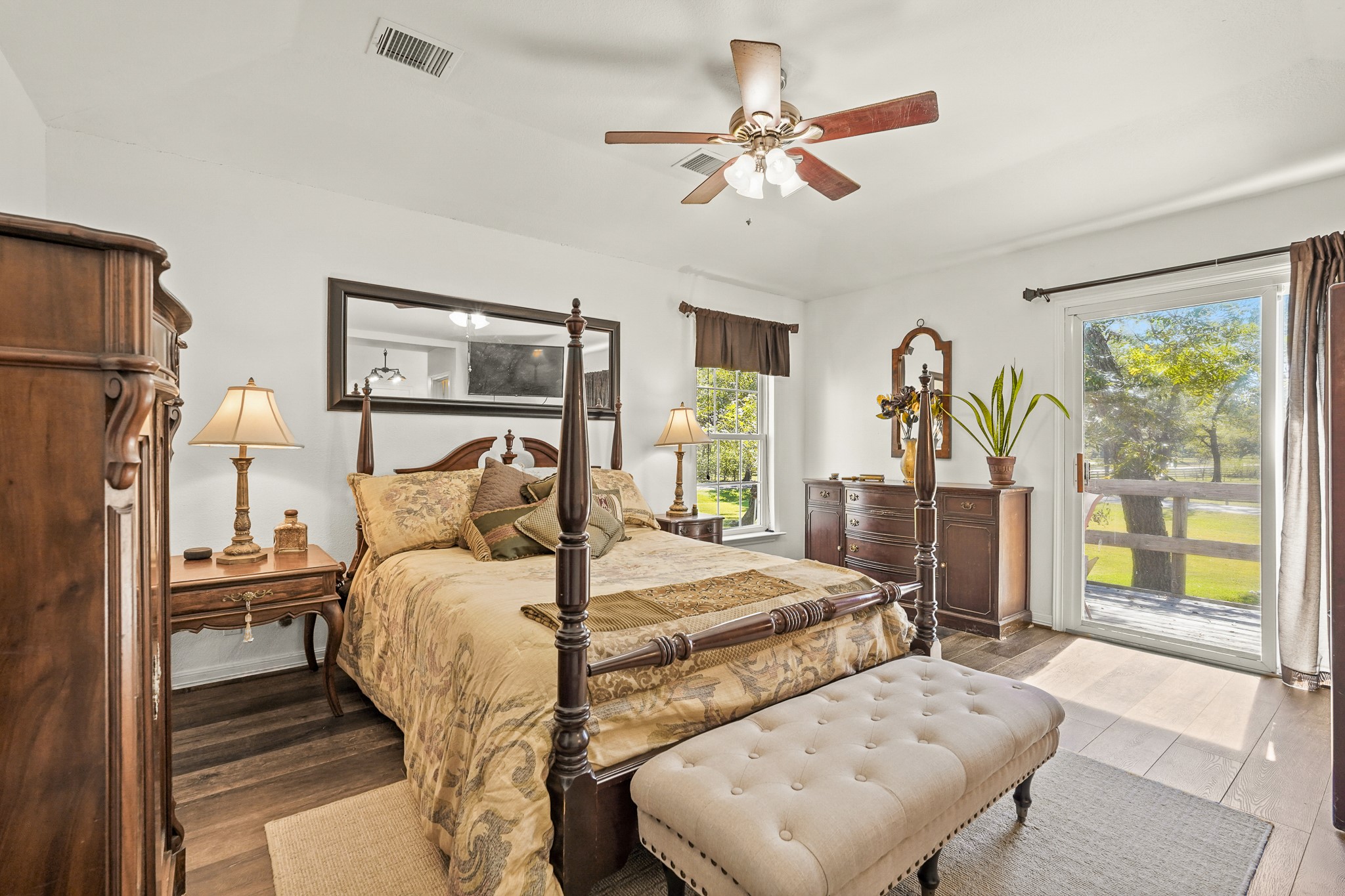 1505 Wagon Road Simonton, TX 77485 - Photo 14 of 50 a bedroom with a bed and a chandelier