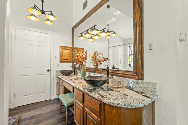 a view of a kitchen area with furniture and chandelier