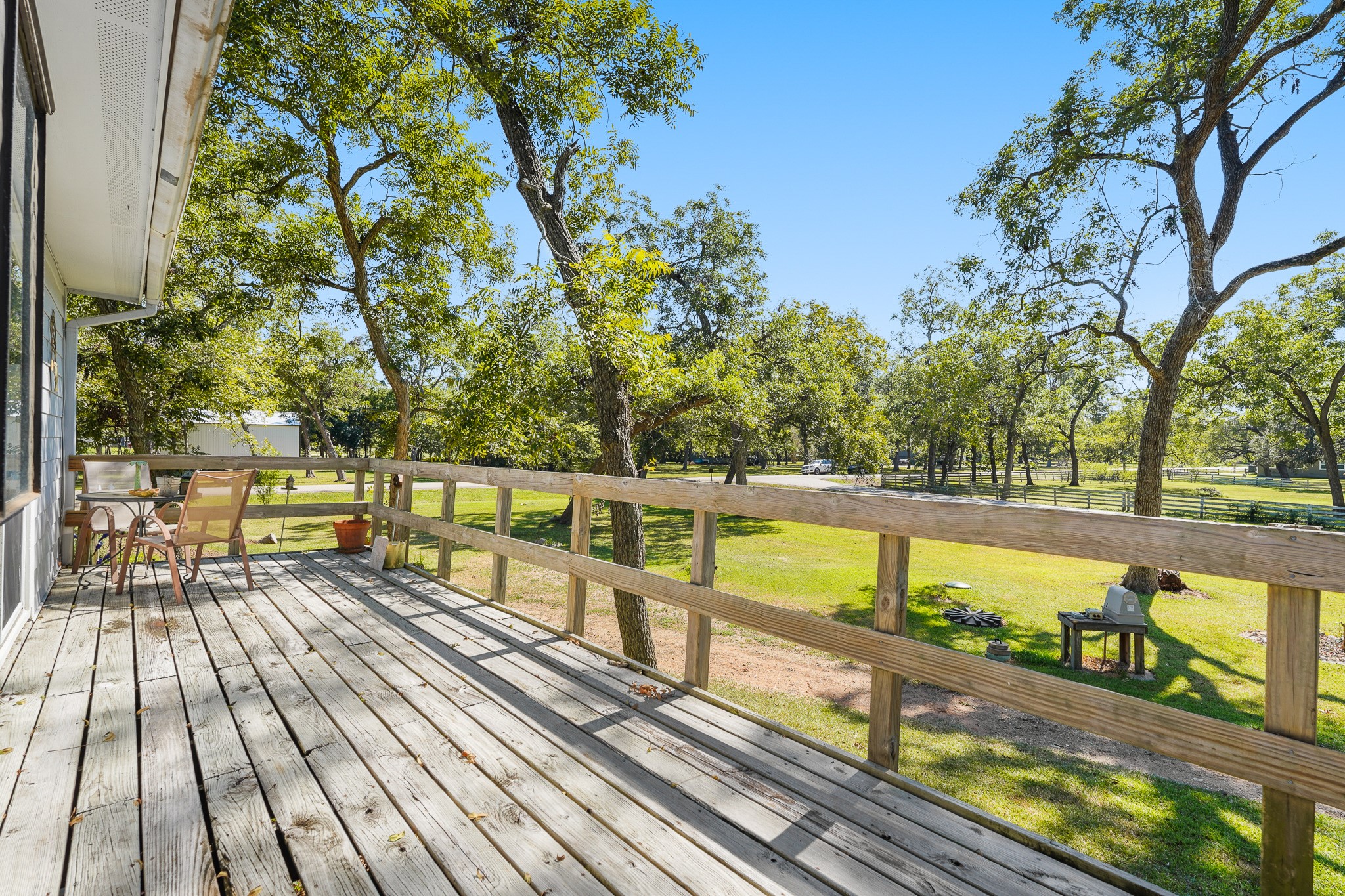 1505 Wagon Road Simonton, TX 77485 - Photo 19 of 50 a view of a balcony with wooden floor and outdoor space
