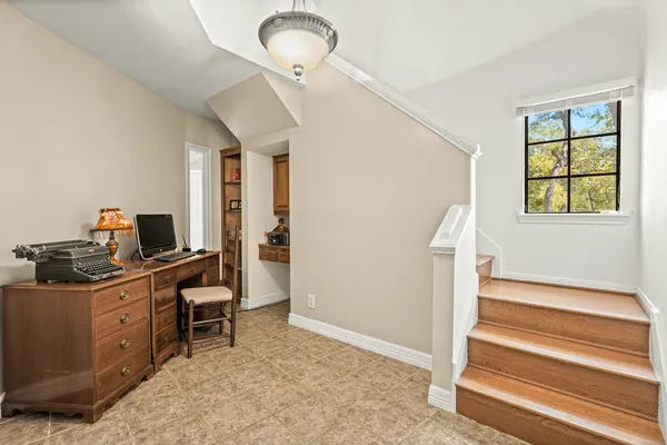a bedroom with furniture and wooden floor
