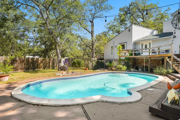 a view of a swimming pool with a patio