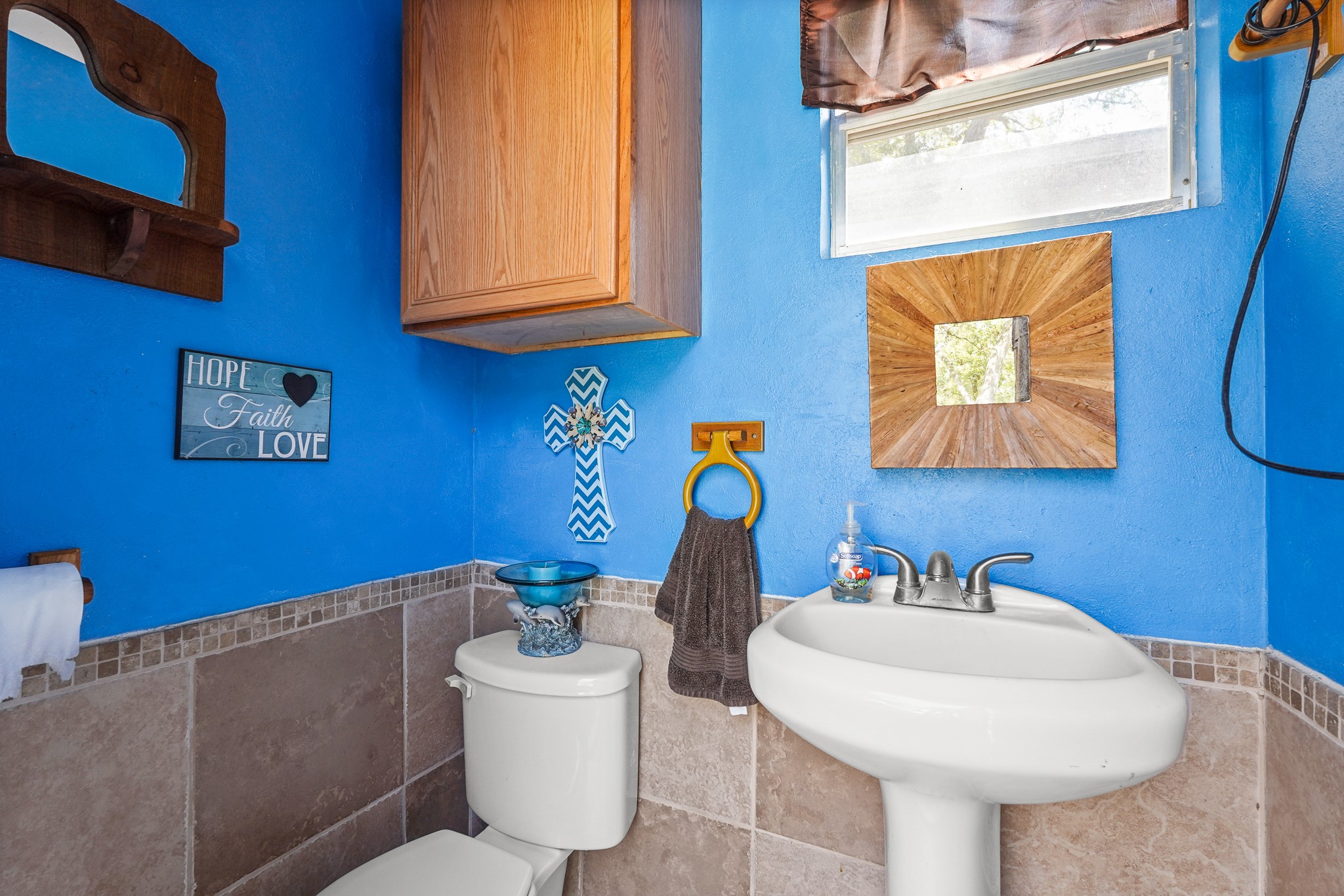 1505 Wagon Road Simonton, TX 77485 - Photo 32 of 50 a bathroom with a sink a mirror and a toilet
