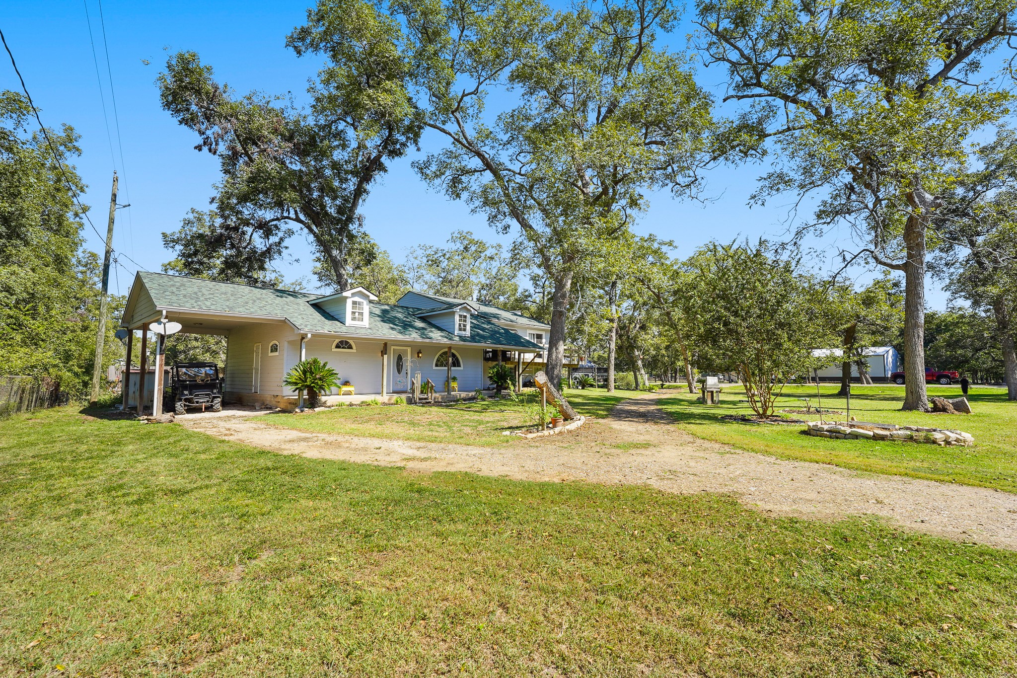 1505 Wagon Road Simonton, TX 77485 - Photo 36 of 50 a view of a house with a big yard and large trees