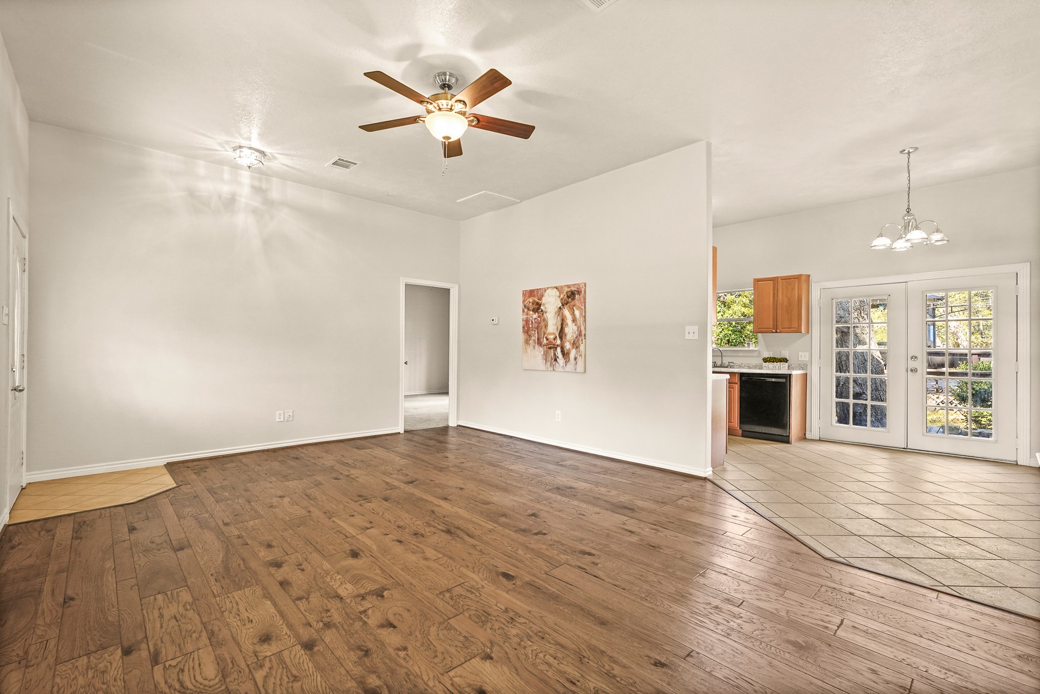 1505 Wagon Road Simonton, TX 77485 - Photo 39 of 50 an empty room with wooden floor and windows