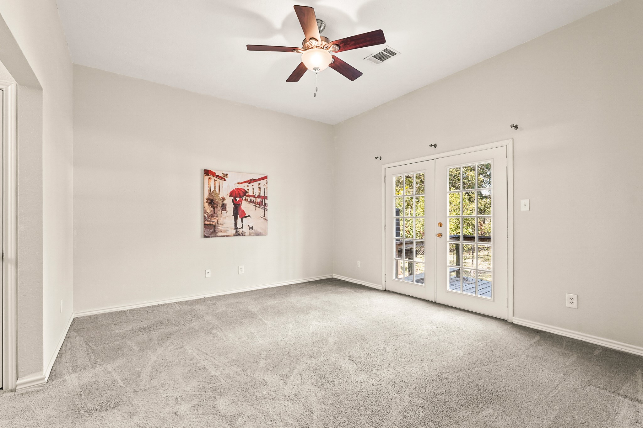 1505 Wagon Road Simonton, TX 77485 - Photo 42 of 50 an empty room with windows and fan