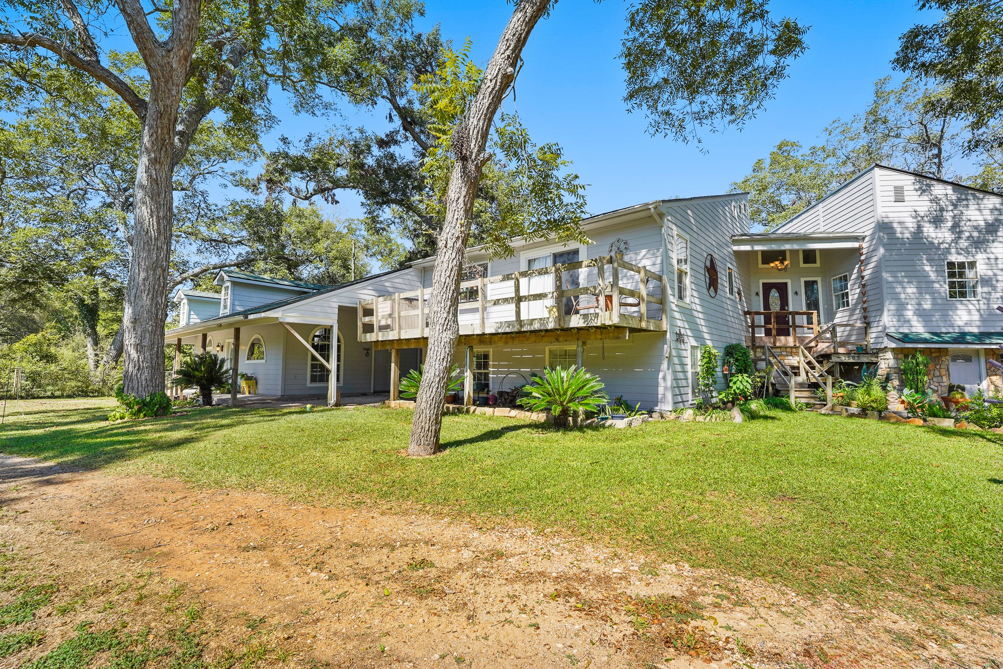 1505 Wagon Road Simonton, TX 77485 - Photo 45 of 50 a front view of a house with a yard and garage