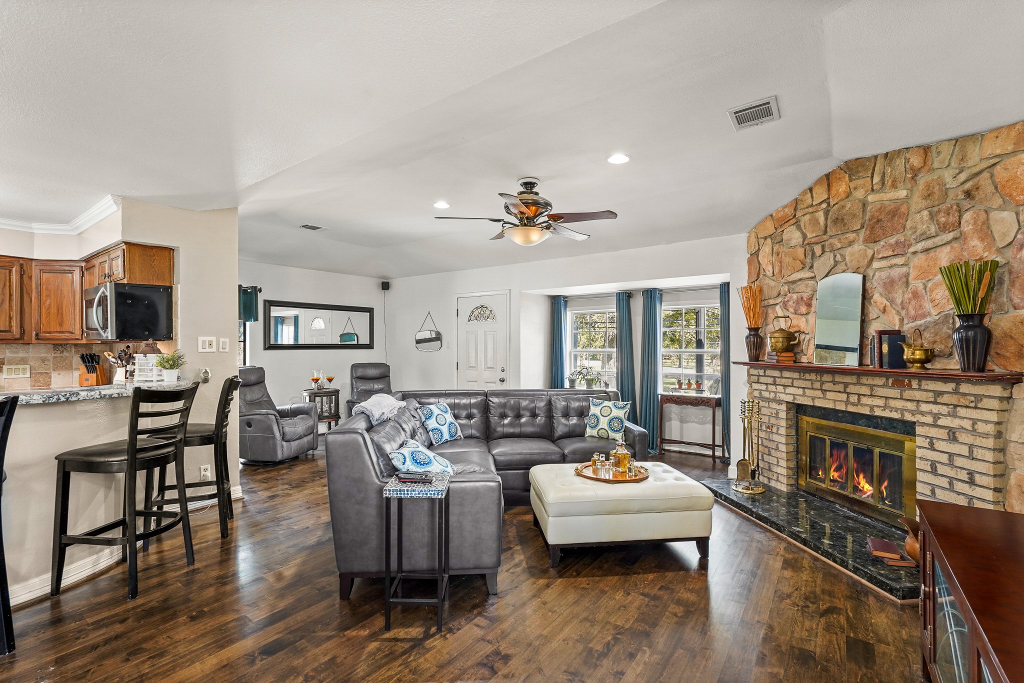 1505 Wagon Road Simonton, TX 77485 - Photo 7 of 50 a living room with furniture and a fireplace
