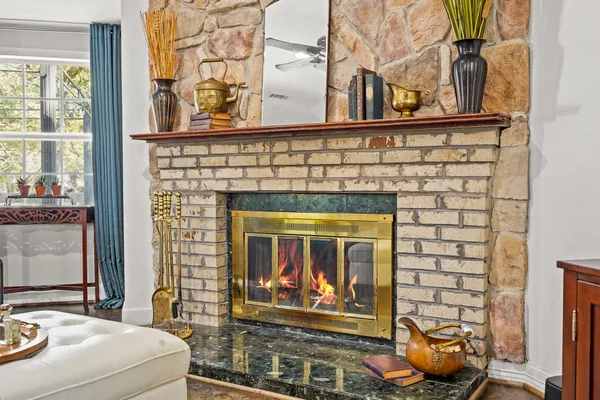 a living room with furniture and a flat screen tv with wooden floor