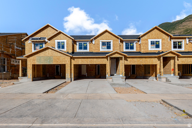 5243 Plum Lane, Unit 771 Mapleton, UT 84664 - Photo 1 of 5 New construction townhome units with integrated garages, concrete driveways, and distinct entryways
