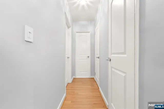 a view of a bathroom from the hallway