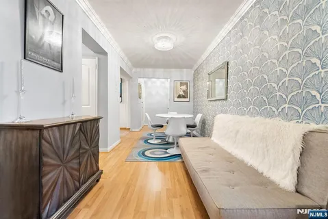 a bedroom with furniture and a wooden floor