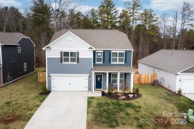 a front view of a house with yard