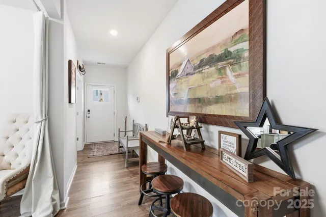 a spacious bedroom with a bed and a tv