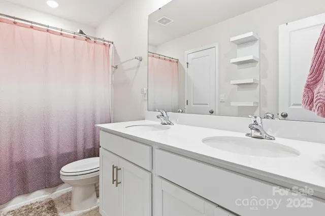 a bed room with a bed and a dresser