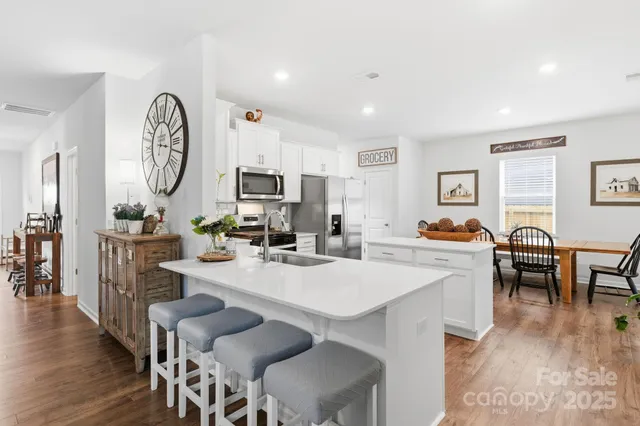 a view of kitchen with cabinets and wooden floor