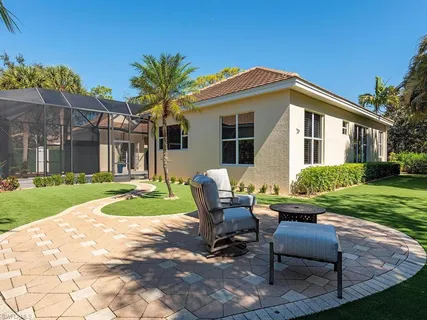 a view of a swimming pool with a patio