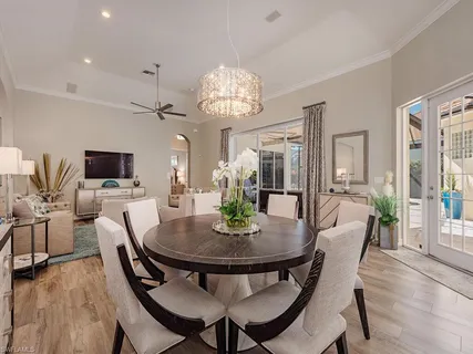 a view of a dining room with furniture and wooden floor