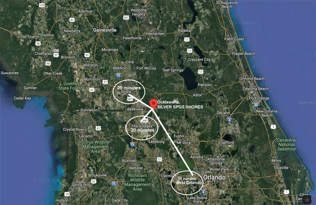 a en suite bathroom with a double vanity sink and a mirror