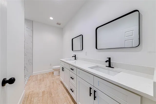 a view of kitchen with wooden floor and window