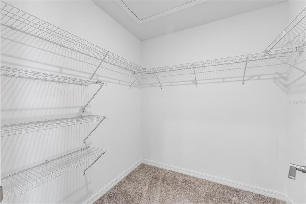 8309 Corner Pine Way New Port Richey, FL 34655 - Photo 20 of 33 a view of a room with racks on the wall