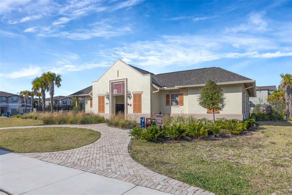 8309 Corner Pine Way New Port Richey, FL 34655 - Photo 29 of 33 a view of a house with a garden