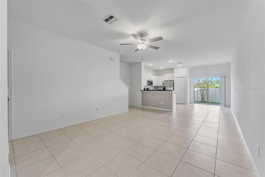 8309 Corner Pine Way New Port Richey, FL 34655 - Photo 8 of 33 a view of a kitchen with a sink and a refrigerator