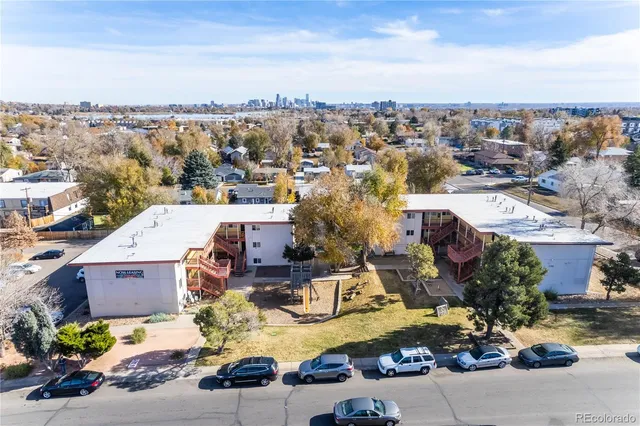 an aerial view of a house with yard swimming pool and ocean view