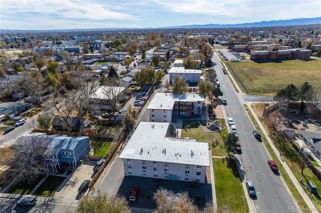 an aerial view of residential houses with outdoor space