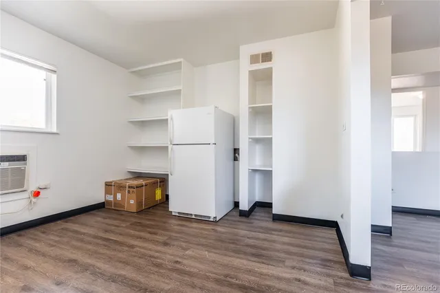 a view of a livingroom with wooden floor